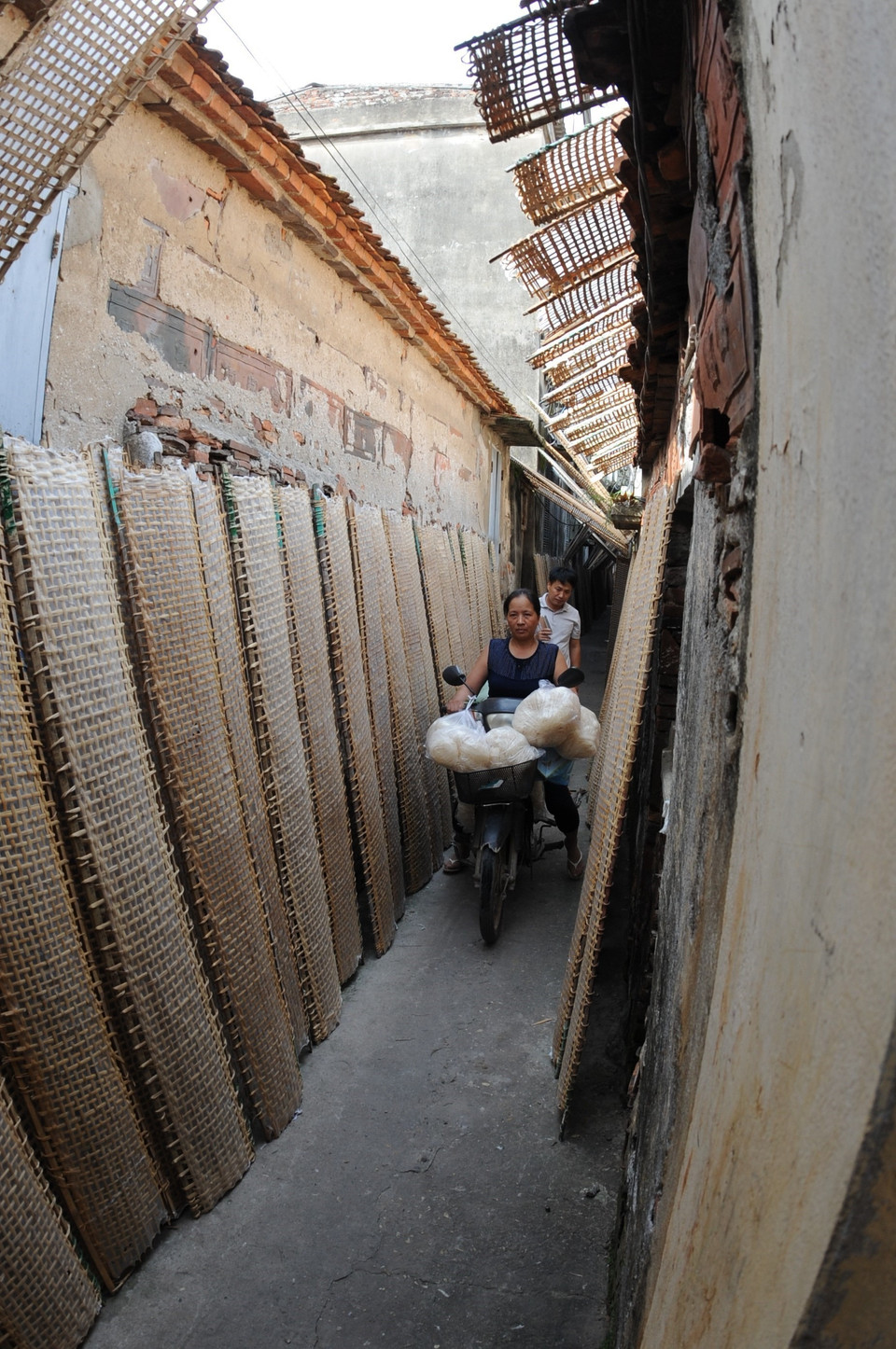 Rice papers can be seen drying along every alley in the village. (Photo: VNA)