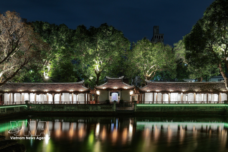 Lighting effects projected onto stone stelae and traditional patterns help highlight intricate heritage details. (Photo: VNA)