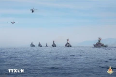 Formations of DHC-6 aircraft and Ka-28 anti-submarine helicopters, together with missile ship squadrons, take part in a naval parade in the waters of Cam Ranh, Khanh Hoa province, during the ceremony and parade celebrating the 80th anniversary of the August Revolution and National Day (September 2). (Photo: VNA)