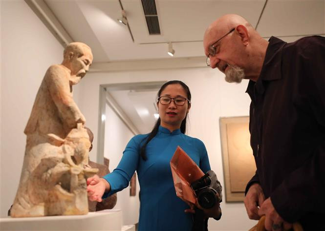 Exhibition-goers on the opening day of the event. (Photo: VNA) 