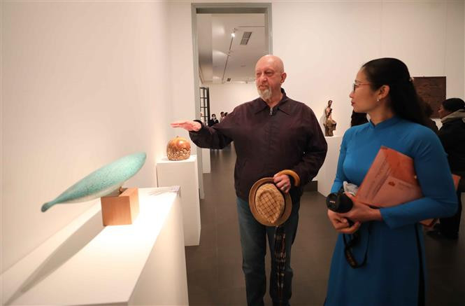 Exhibition-goers on the opening day of the event. (Photo: VNA) 