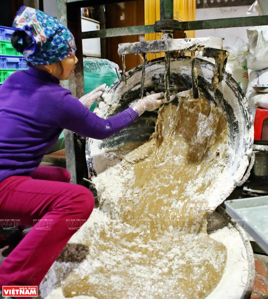 Well-stirred mixture is spread into flat winnowing baskets (Photo: VNA)