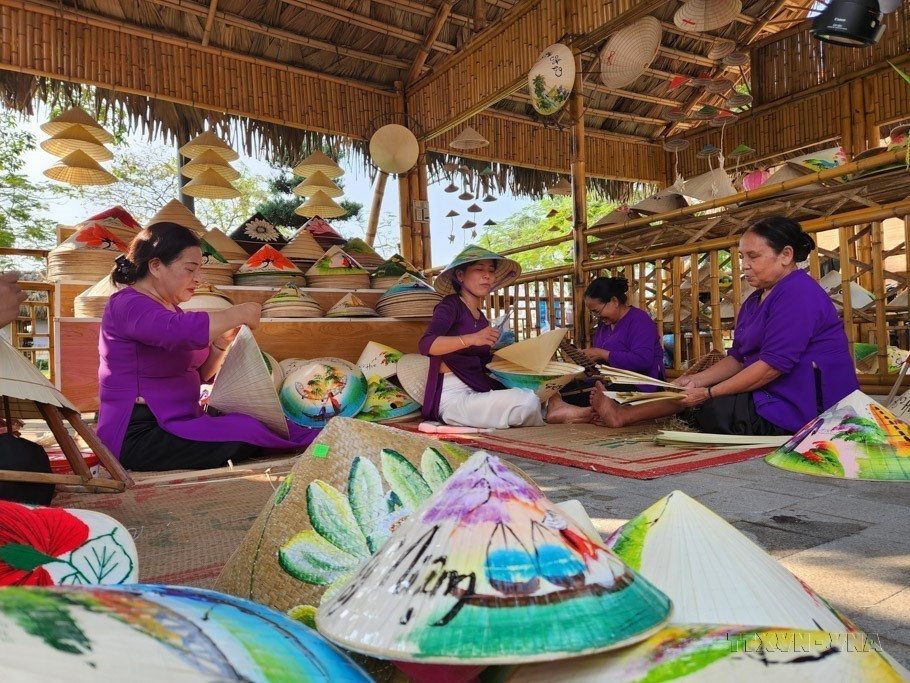 Women actively engage in preserving and developing the traditional craft of conical hat making in Van The village in the central province of Thua Thien-Hue. (Photo: VNA)