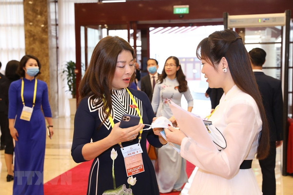 Participants using masks to attend the opening ceremony in Hanoi. (Photo: VNA)