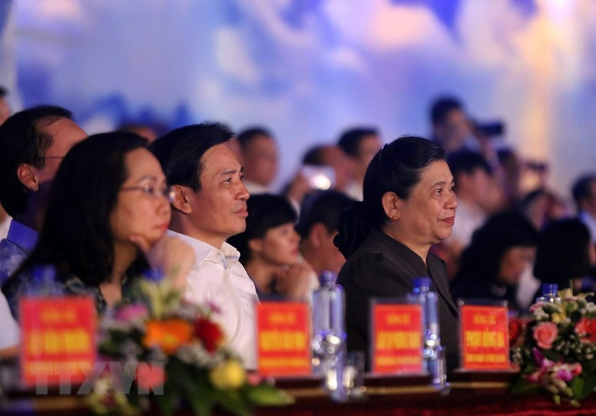 Permanent Vice Chairwoman of the National Assembly Tong Thi Phong (first right) at the event (Photo:VNA)