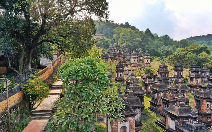 A long wall around the tower garden was built from mountain rocks, bricks and clay, creating a serene and deep look for the garden. (Photo: Mai Mai/Vietnamplus)