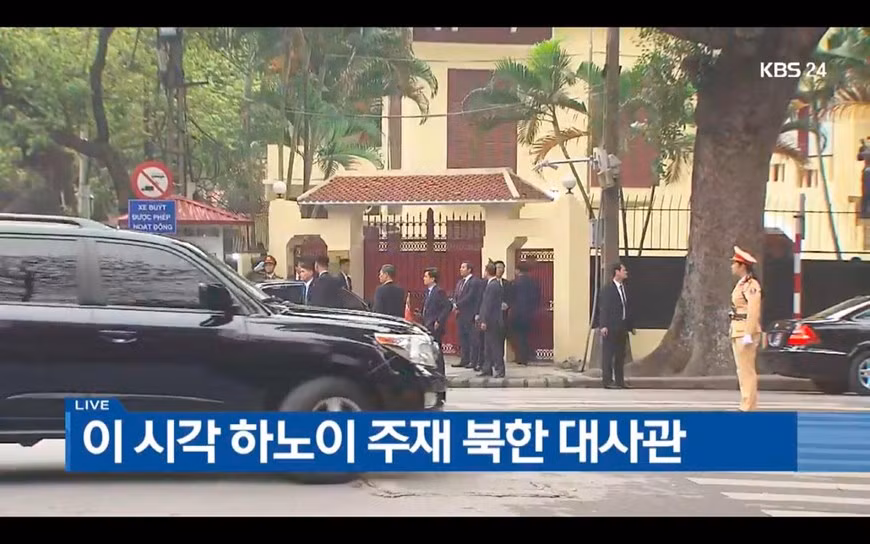 The escort team are waiting outside the embassy 