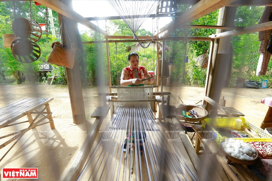 Thai ethnic people’s weaving looms are made from wood and generally big (Photo: VNA)