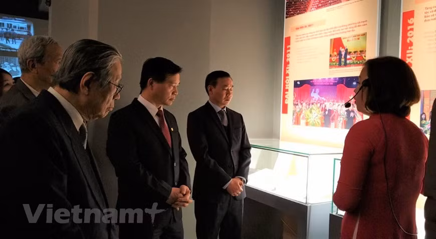 Director of the Vietnam National Museum of History Nguyen Van Doan (second from right) and other delegates visit the exhibition. Featuring more than 200 documents, objects, and photos, the exhibition aims to mark the 91st founding anniversary of the Communist Party of Vietnam (February 3, 1930 - 2021) and welcome the upcoming 13th National Party Congress. The museum’s director said the event looks to provide the public, especially young people, with a better understanding about the Party’s history apart from Vietnam’s achievements under the leadership of the Party. It will help them become better aware of their responsibility towards the building of a prosperous, peaceful, and developed Vietnam (Photo: VietnamPlus)