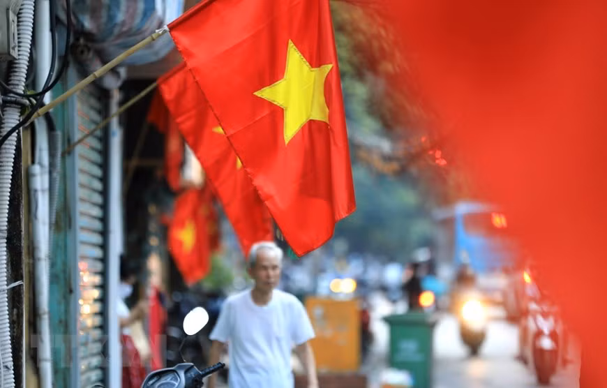 Hang Bong Street in downtown Hanoi is painted red with flags celebrating National Day. (Photo: VNA)