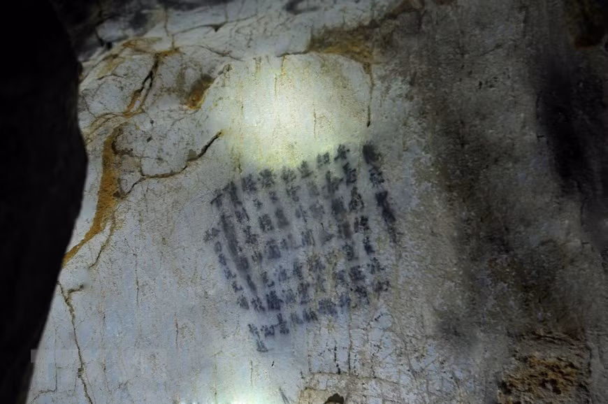 An ancient writing found in the cave (Photo: VNA)