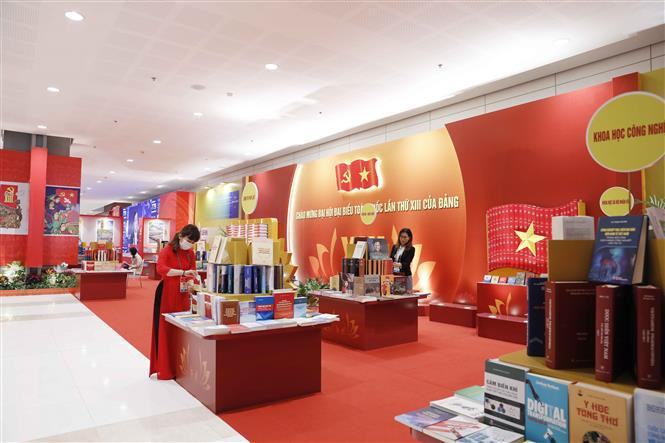The exhibition aims to mark the 13th National Party Congress. (Photo: VNA)