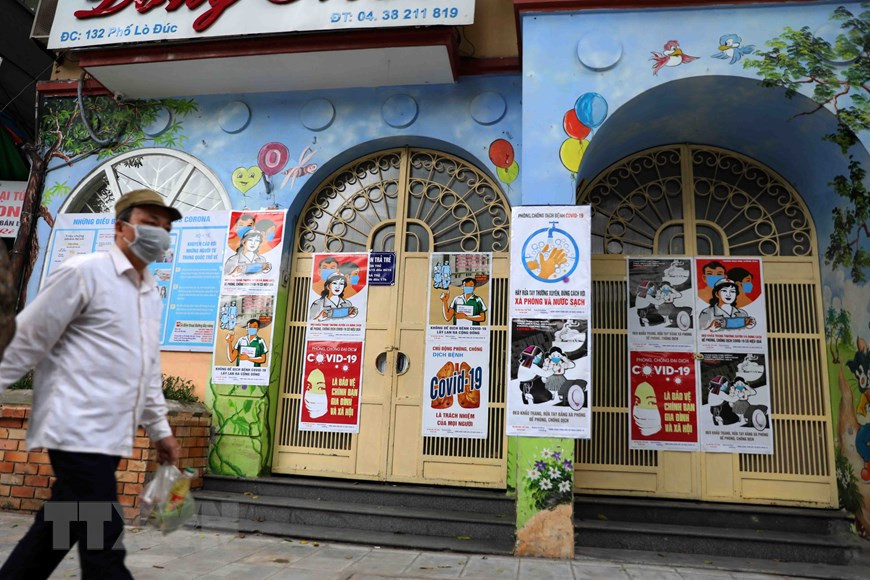Posters are hung at entrance of local authorities’ headquarters and schools (Photo: VNA)