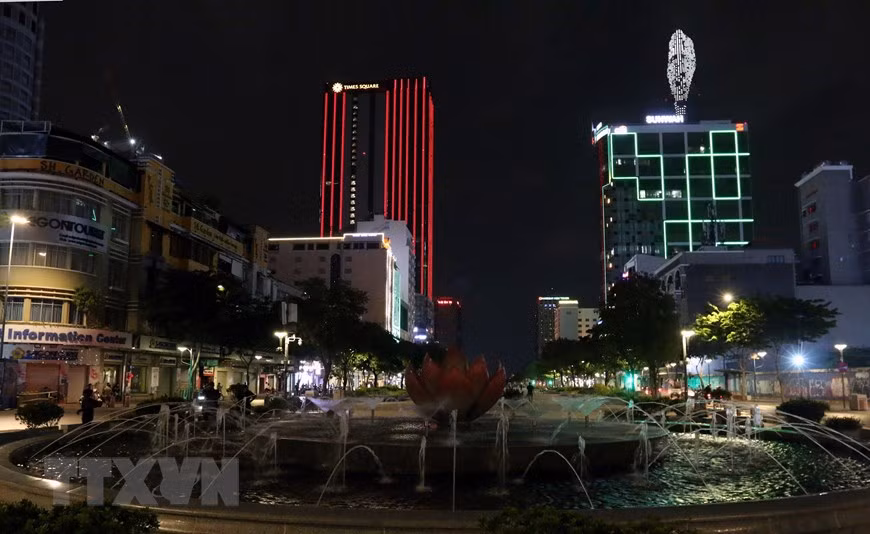 A smiling face at Ho Chi Minh City’s iconic building of Bitexco (right corner) (Photo: VNA)
