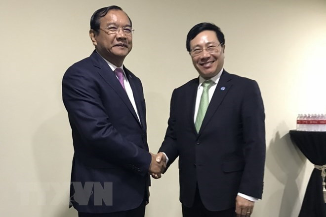 Deputy PM and Foreign Minister Pham Binh Minh meets with Cambodian Minister of Foreign Affairs and International Cooperation Prak Sokhonn on August 2 (Photo: VNA)