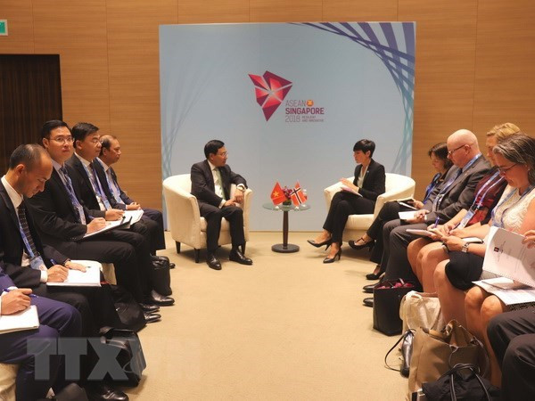 The meeting between Deputy PM and Foreign Minister Pham Binh Minh and Norwegian Foreign Minister Eriksen Søreide on August 2 (Photo: VNA)