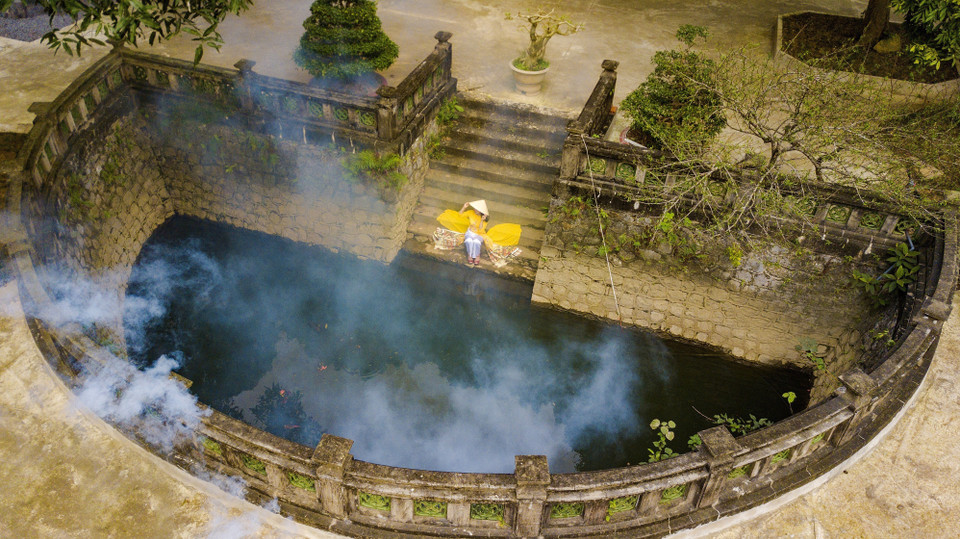 A semi circular lake with ancient features inside Thien Ton Pagoda. (Photo: VNA)