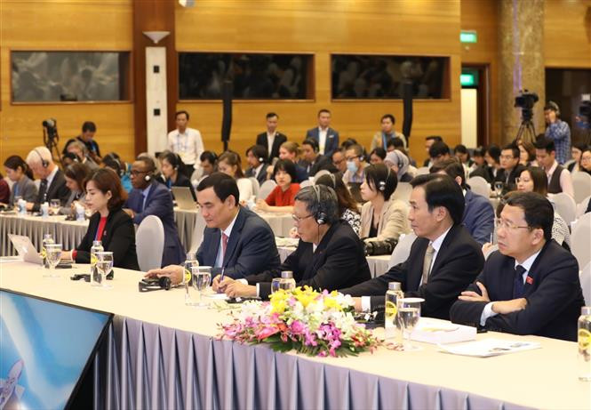 Domestic, international delegates and reporters at the press conference (Photo: VNA)