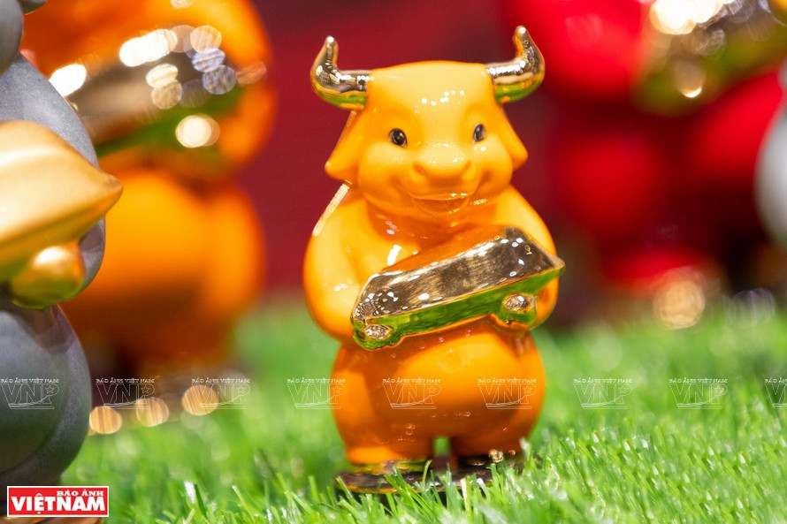 Nhu Y (good things) is a statue of a buffalo with a lovely smile, standing on two feet, holding a golden grain of rice, implying that fortune will come in the New Year. (Photo: VNA)