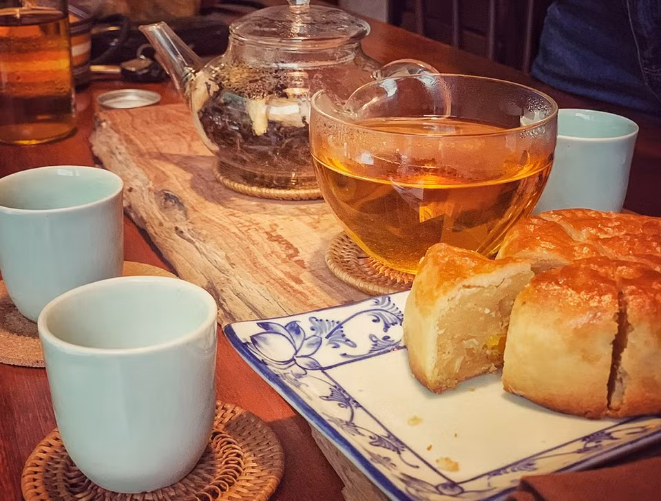 Definitely, don’t forget to enjoy the tea with a piece of mooncake. Mooncake is a small, round pastry stuffed with either sweet or savoury filling. There are many different variations of the mooncake, depending on where in Asia you’re from – the only common element being the symbolism of the moon. Some bakeries stuff up to four salted egg yolks into a single mooncake, because the more moons you have, the more plentiful the bounty for the receiver. You’ll also see red bean paste, mung bean paste, sesame paste and a five-seed mix in some mooncakes, although they’re not as easy to find.