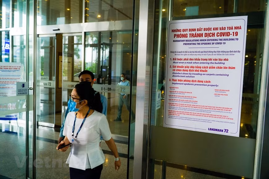 Regulations for people entering and exiting Landmark 72 Building, which is home to many Korean residents and Korean-based offices (Photo: Minh Hieu/Vietnam+)