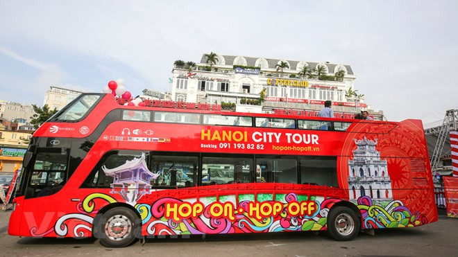 The “Hop on-Hop off” bus service designed by Hanoitourist travel company aims to offer tourists a new and more convenient way to explore Hanoi’s tourist attractions. (Photo: VNA) 