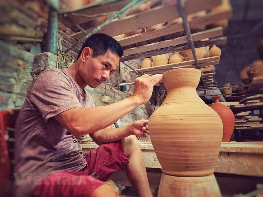 While neighbours applied mass assembly lines to turn out thousands of products every day, he made only few hundred items every month. Yet his products were unique, none was similar to another. (Photo: Vietnam+)