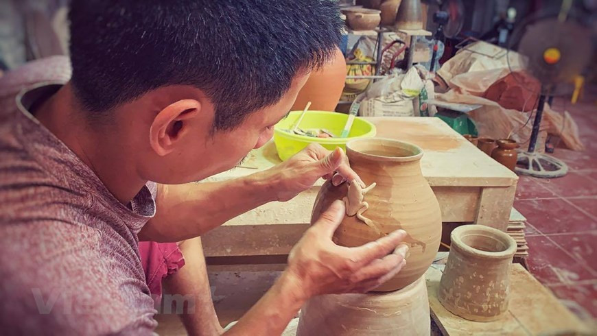 While neighbours applied mass assembly lines to turn out thousands of products every day, he made only few hundred items every month. Yet his products were unique, none was similar to another. (Photo: Vietnam+)