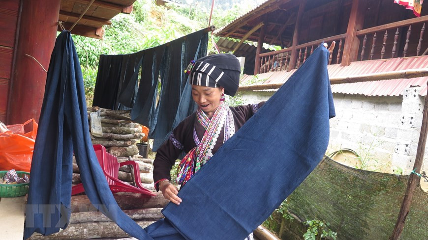 Cloth pieces are divided into smaller pieces and embroidered before being cut and sewed into actual costumes (Photo: VNA)