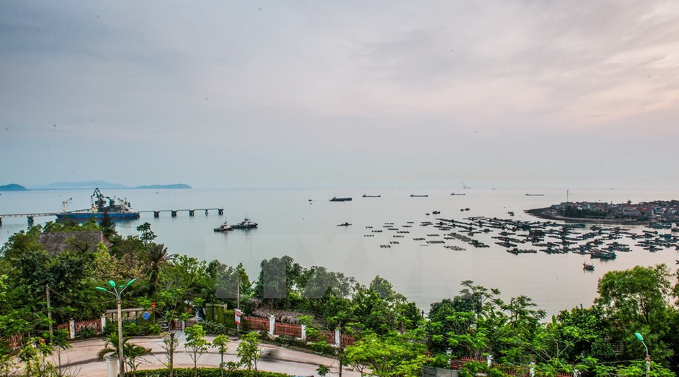 A corner of a boat landing in Nghi Son island commune and the Nghi Son deep-water port area (Source: VNA)