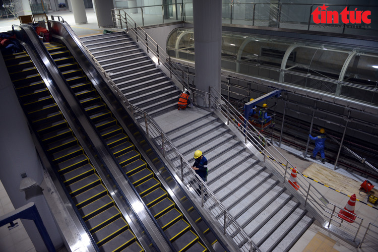 Escalators and stairs connecting the first and second floors.