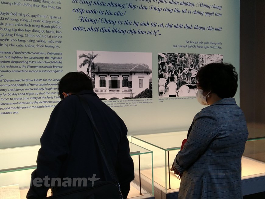 Visitors to the exhibition. The thematic exhibition 'Viet Bac - the Capital of Forest Wind' is being held by the Vietnam National Museum of History and the Archives of the Office of the Party Central Committee on the occasion of the 75th anniversary of the National Resistance Day (December 19, 1946 - 2021). The exhibition showcases nearly 200 documents, objects and photos. The objects conveyed the message of the nation’s aspiration for peace and independence, thereby affirming the leadership role of the Party and President Ho Chi Minh as well as the contributions of people to the resistance war against the French colonialists (1946 -1954). (Photo: VietnamPlus)
