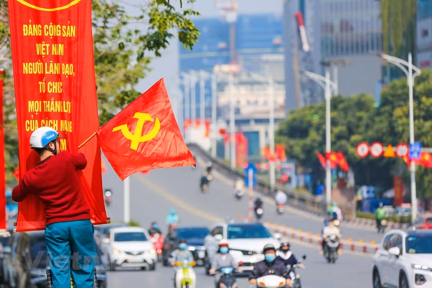 Posters and banners are installed in the area of Nguyen Chi Thanh street. (Photo: Minh Son/Vietnamplus)