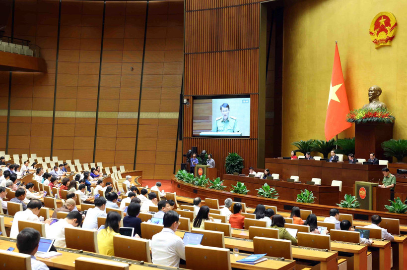 Minister of Public Security Sen. Lt. Gen. Luong Tam Quang presents Government’s proposal on the draft revised Law on Human Trafficking Prevention and Control on June 7. (Photo: VNA)