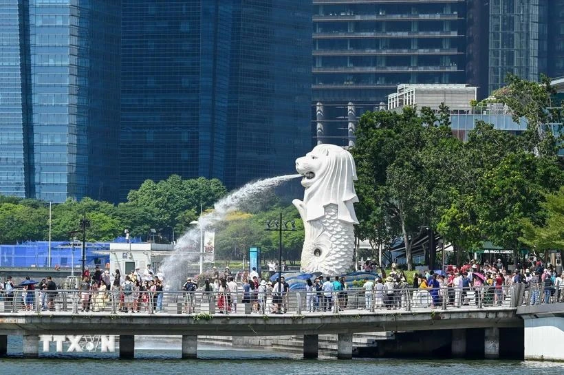 Visitors to Marina Bay of Singapore (Photo: AFP/VNA)