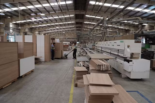 Wooden goods are made for export at a factory in Long An province. (Photo: VNA)