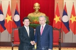 Party General Secretary To Lam (R) and Party General Secretary and President of Laos Thongloun Sisoulith (Photo: VNA)