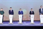 Prime Minister Pham Minh Chinh (middle) and delegates launch the Trump International Hung Yen project on May 21 with the ceremonial button-pressing. (Photo: VNA)