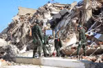 Vietnamese rescuers work to reach trapped victims under rubble. (Photo: VNA)
