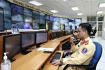 Traffic police officers on duty handling violations through the camera system at the Hanoi Traffic Control Centre. (Photo: VNA)