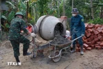 The military forces help build and repair homes for flood-affected households, in the spirit of the 'Quang Trung campaign' (Photo: VNA)