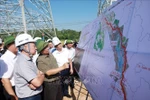 Prime Minister Pham Minh Chinh (second from left) inspects the construction process of 500kV Lao Cai – Vinh Yen transmission line project (Photo: VNA)