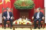 Party General Secretary To Lam (R) and President and CEO Eric Hambly of Murphy Oil Corporation in Hanoi on October 15. (Photo: VNA)