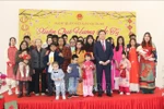 Participants pose for a group photo at the “Xuan Que Huong” (Homeland Spring) programme in New Delhi, India on January 19, 2025). 