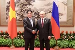 Vietnamese State President Luong Cuong (left) meets with Russian President Vladimir Putin in Beijing on September 3, 2025. (Photo: VNA)