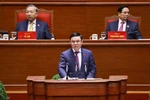Acting Minister of Industry and Trade Le Manh Hung delivers a speech at a discussion during the 14th National Party Congress on January 21 (Photo: VNA)