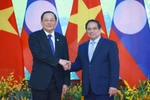 Prime Minister Pham Minh Chinh and his Lao counterpart Sonexay Siphandone in Hanoi on April 16. (Photo: VNA)