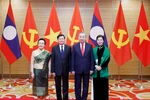Party General Secretary To Lam and his spouse pose with Lao Party General Secretary and President Thongloun Sisoulith and his spouse in Hanoi on January 26, 2026. (Photo: VNA)
