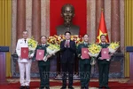 State President Luong Cuong (centre) and the newly promoted officers at the ceremony. (Photo: VNA)