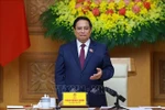 Prime Minister Pham Minh Chinh addresses the 14th meeting of the Central Council for Emulation and Commendation in Hanoi on October 20 (Photo: VNA)